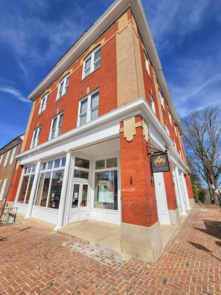 The Summers building at 201 E Main Street in Abingdon, Virginia, a red brick corner building housing the therapy office